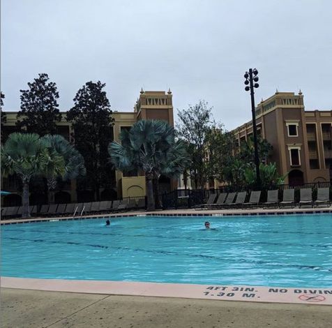 The kids swimming in the hotel pool